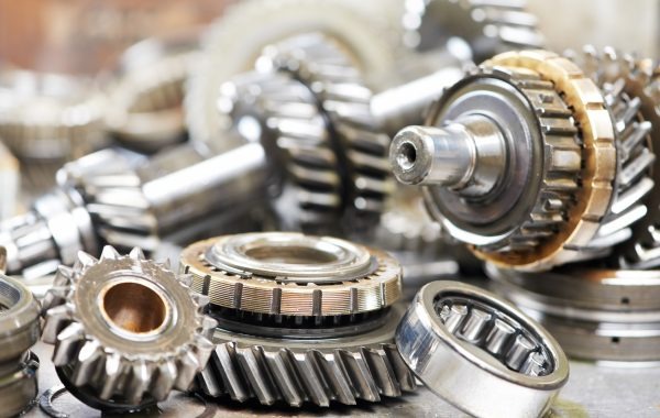 Close-up of automobile engine steel gears and bearings disassembled for repair at car service station